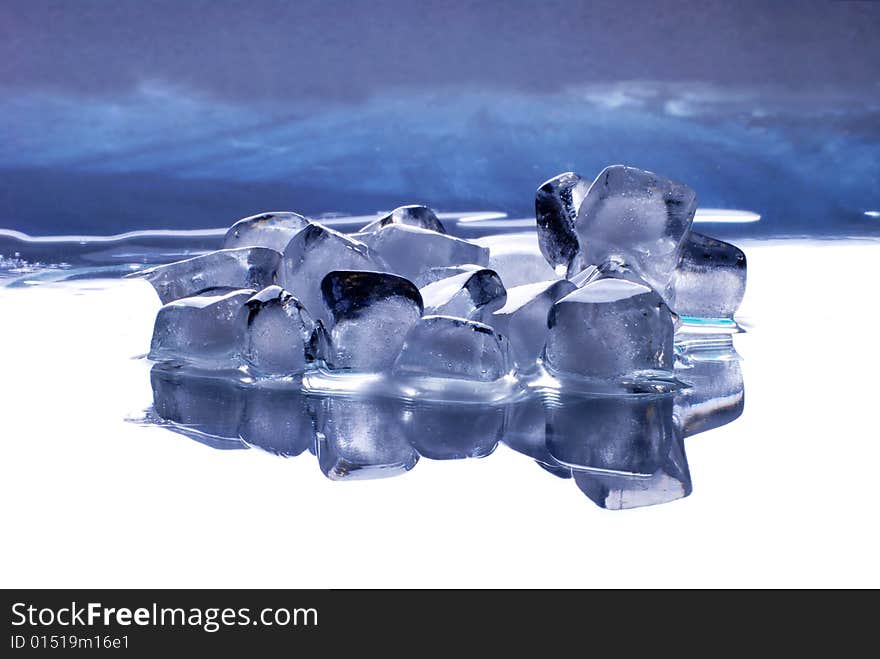 Ice cubes in smooth reflected  background