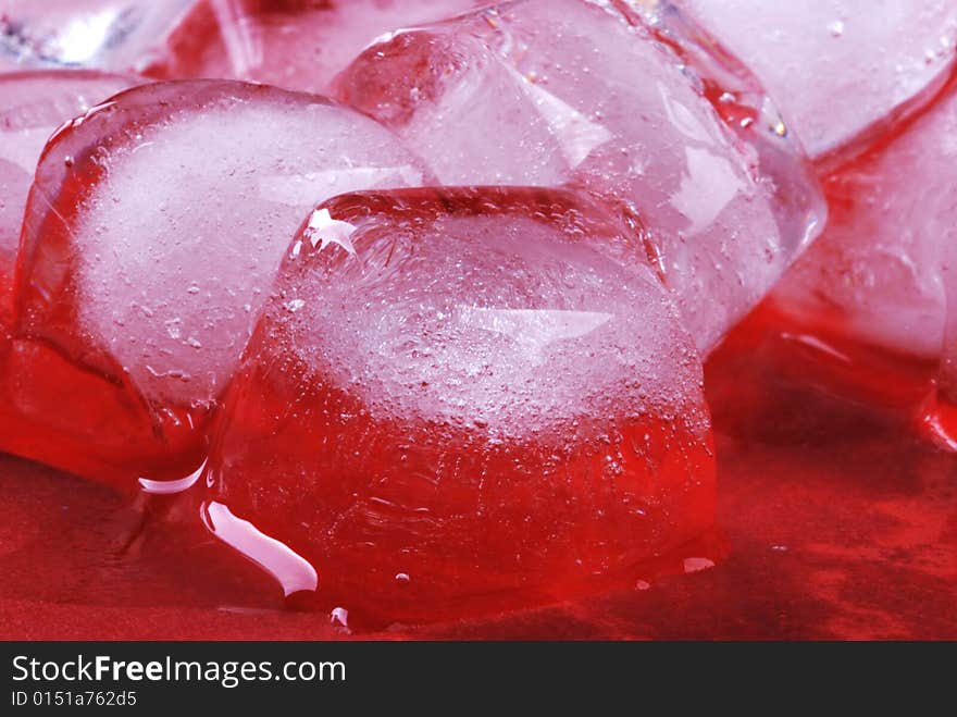 Ice cubes in red background. Ice cubes in red background