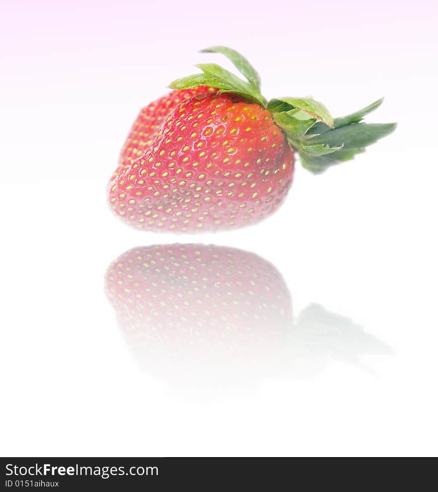 Abstracted manipulated image of strawberry reflected on shiny surface. Abstracted manipulated image of strawberry reflected on shiny surface