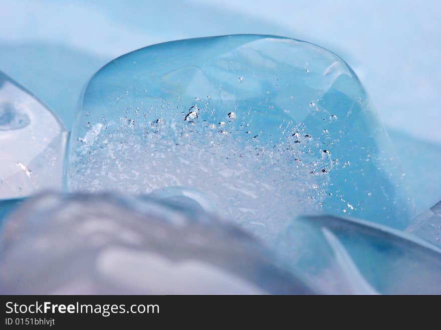 Ice cubes in blue background. Ice cubes in blue background