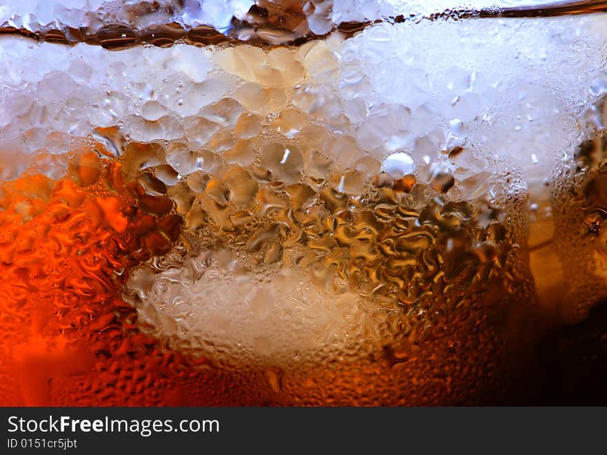 Alcohol drink with ice cube in  cristal glass