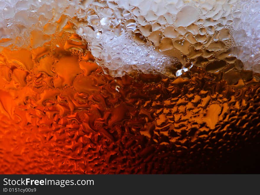 Alcohol drink with ice cube in  cristal glass