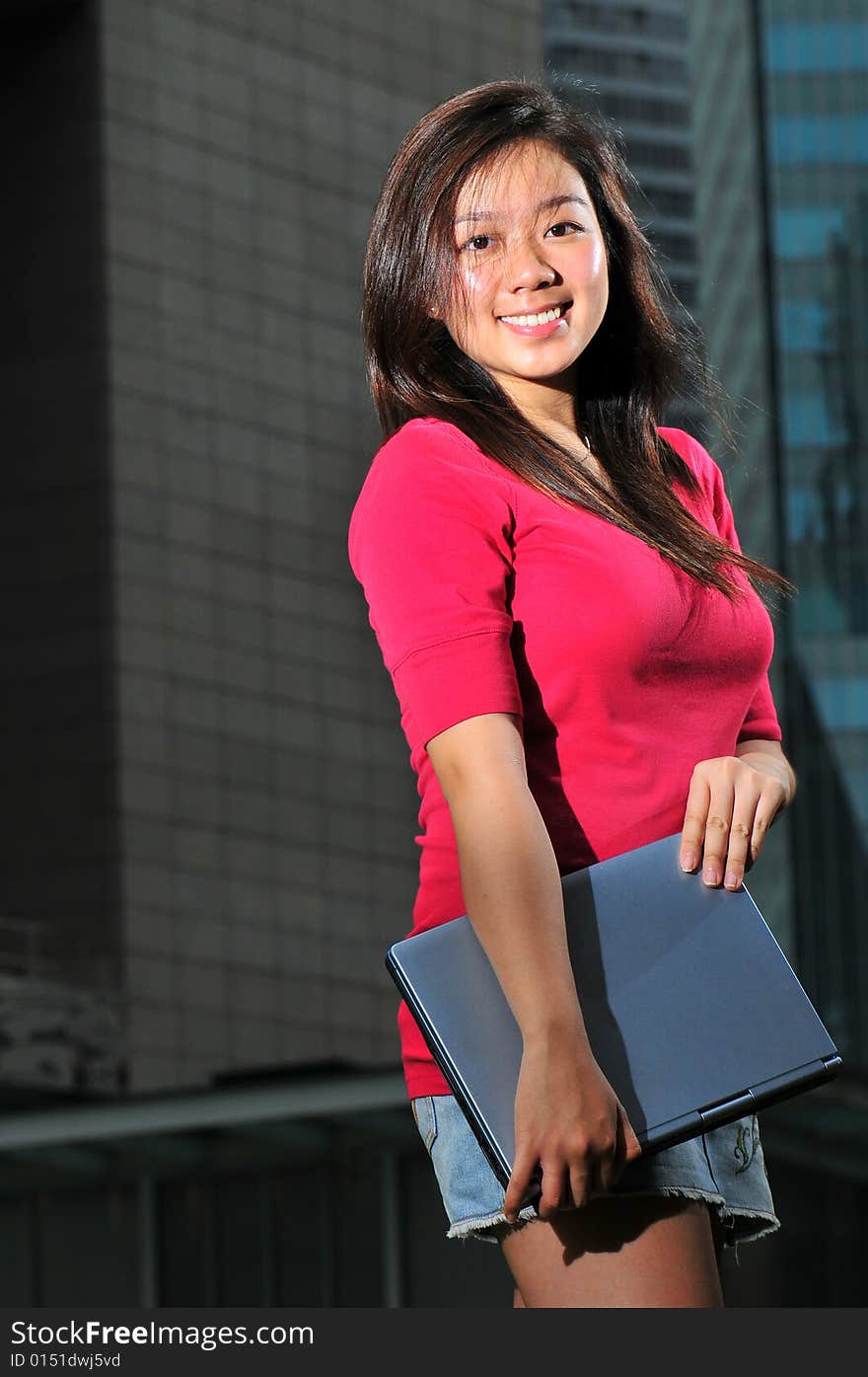 Picture of an Asian Girl with office landscape behind. Suitable for contexts of office environment, casual staff, part-timers, and even interns. Picture of an Asian Girl with office landscape behind. Suitable for contexts of office environment, casual staff, part-timers, and even interns.