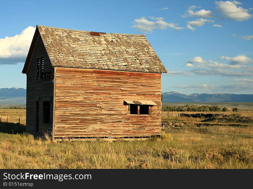 Delapidated wooden building in rural desert landscape. Delapidated wooden building in rural desert landscape