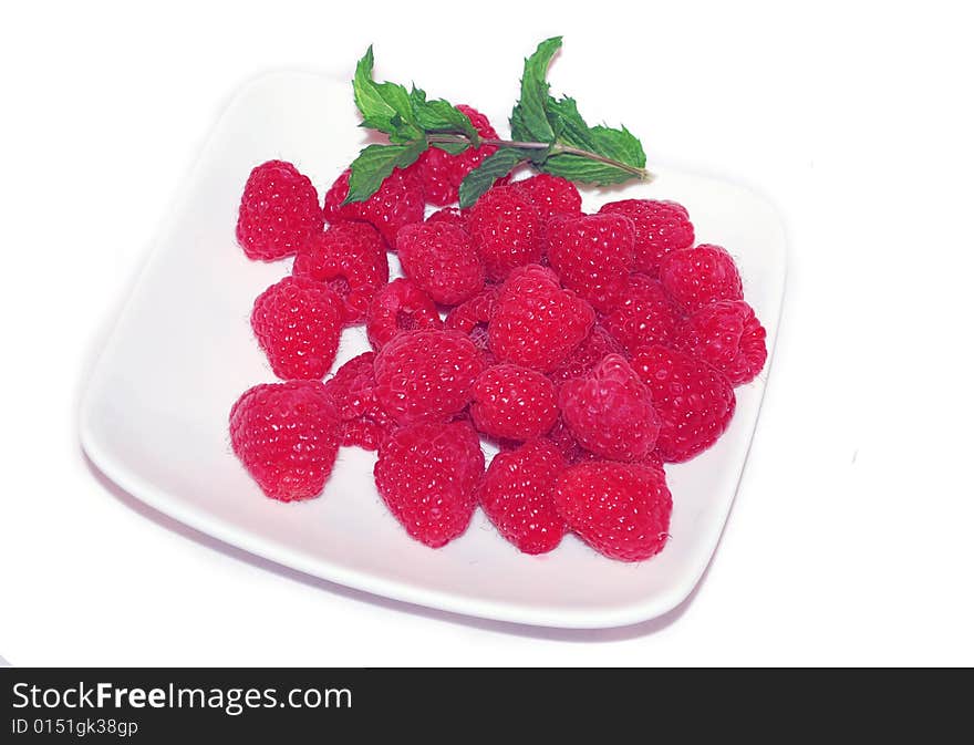 Raspberry On The White Plate