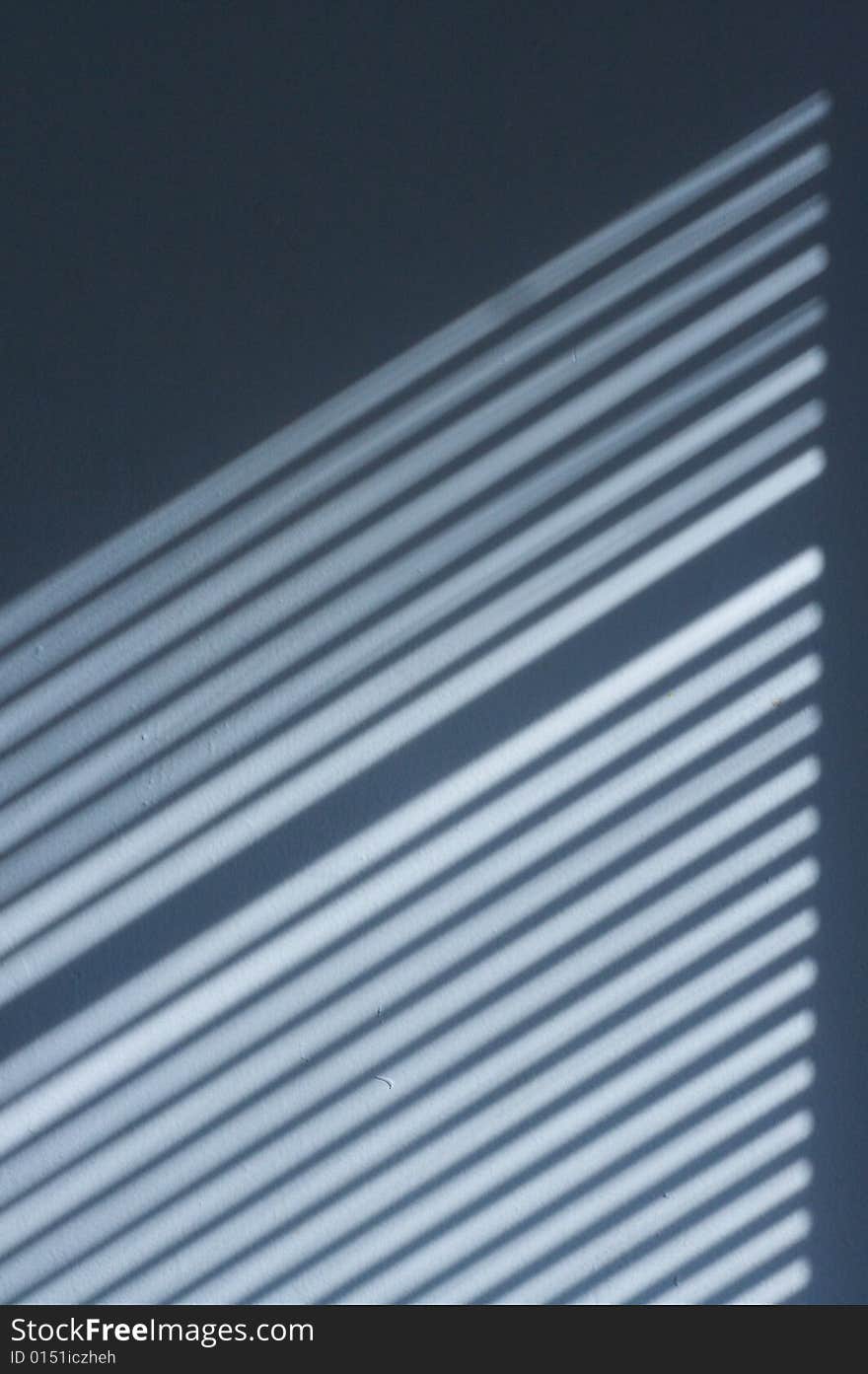 Abstract photo of the shadow of blinds casted onto a wall. Abstract photo of the shadow of blinds casted onto a wall