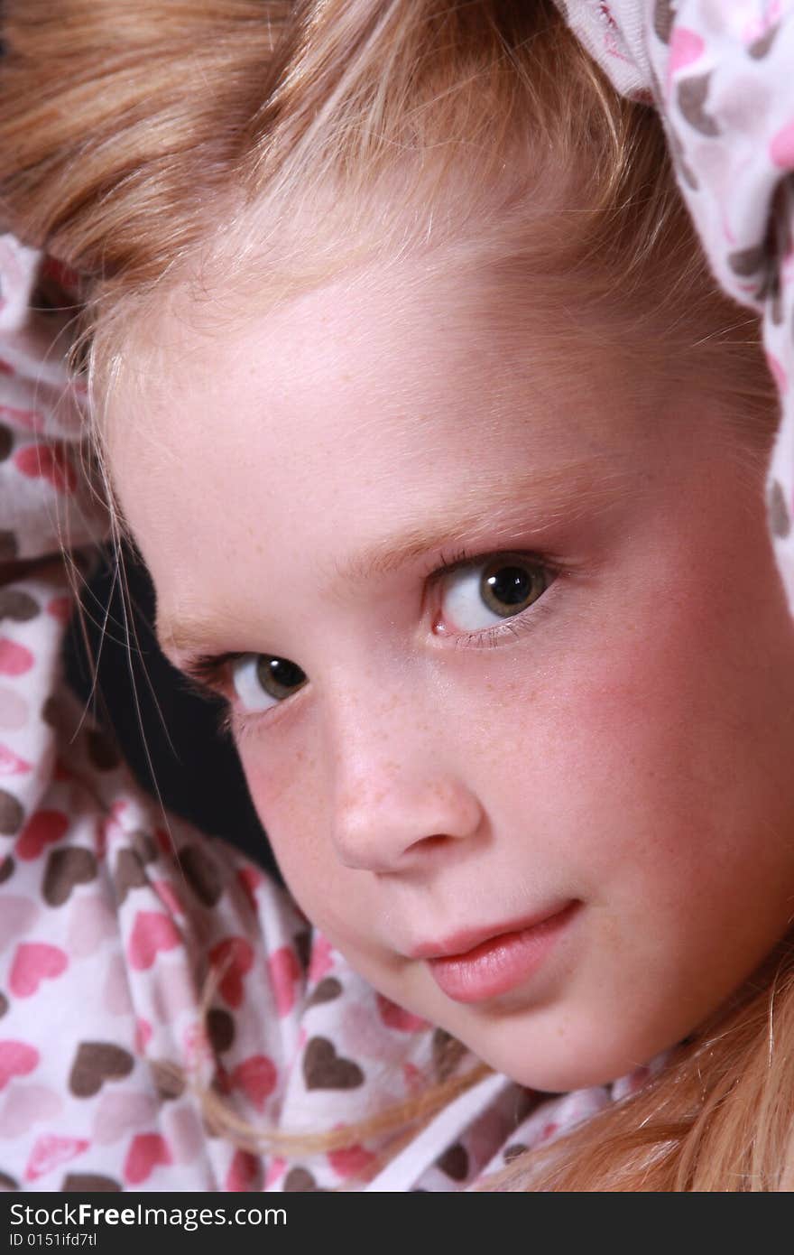 Little girl posing in front of the camera. Little girl posing in front of the camera