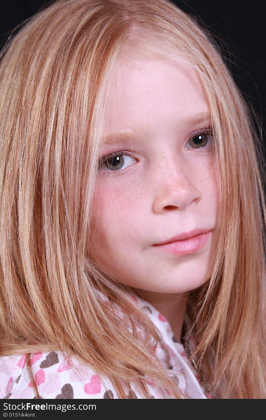 Little girl posing in front of the camera. Little girl posing in front of the camera