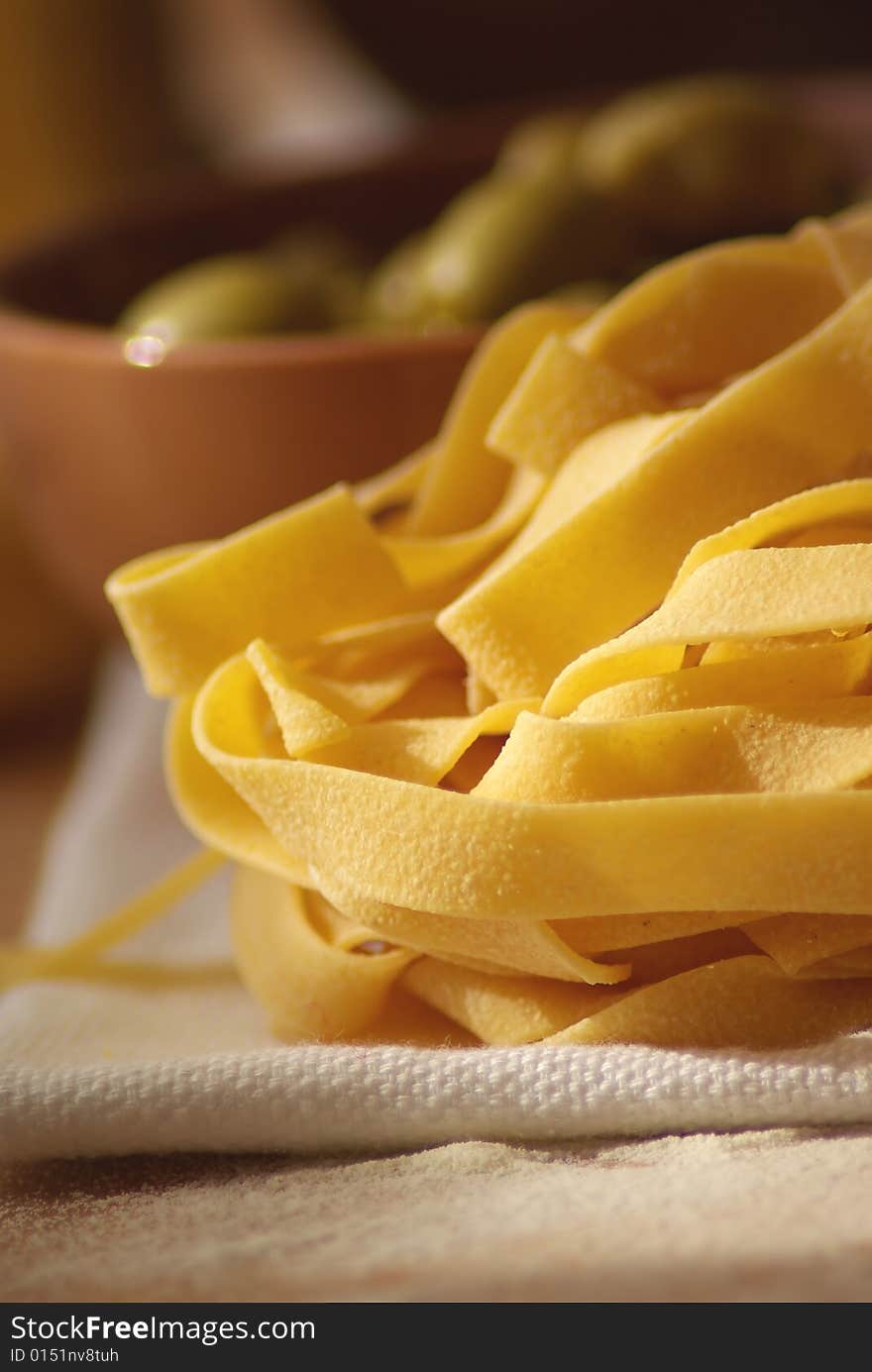 Close up of italian home made pasta and olives