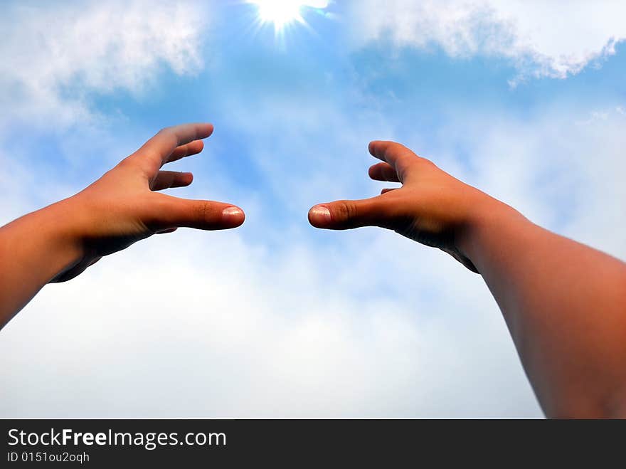 Hands catching the sun, background