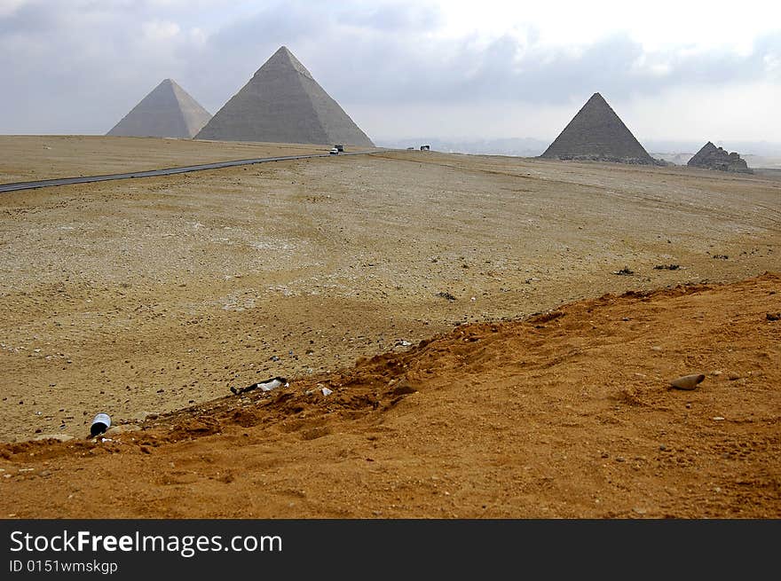 three pyramids in cairo with cloudy background. three pyramids in cairo with cloudy background