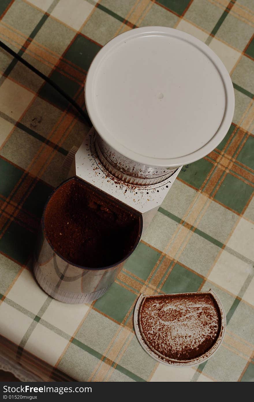 Electric coffee mill on the table. Narrow depth of field. Electric coffee mill on the table. Narrow depth of field.