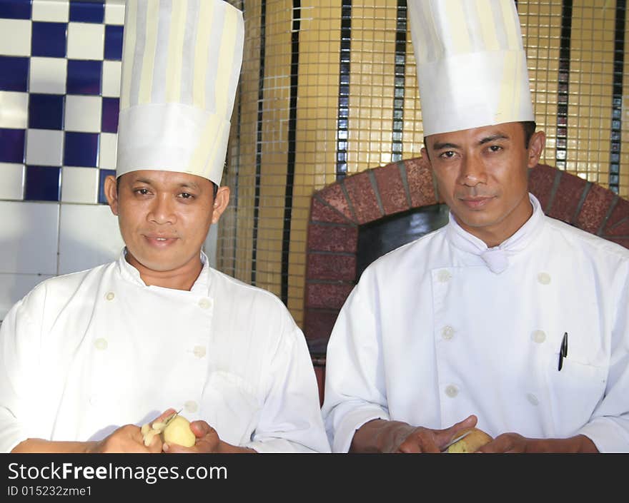 Two chef standing at front of pizza oven. Two chef standing at front of pizza oven