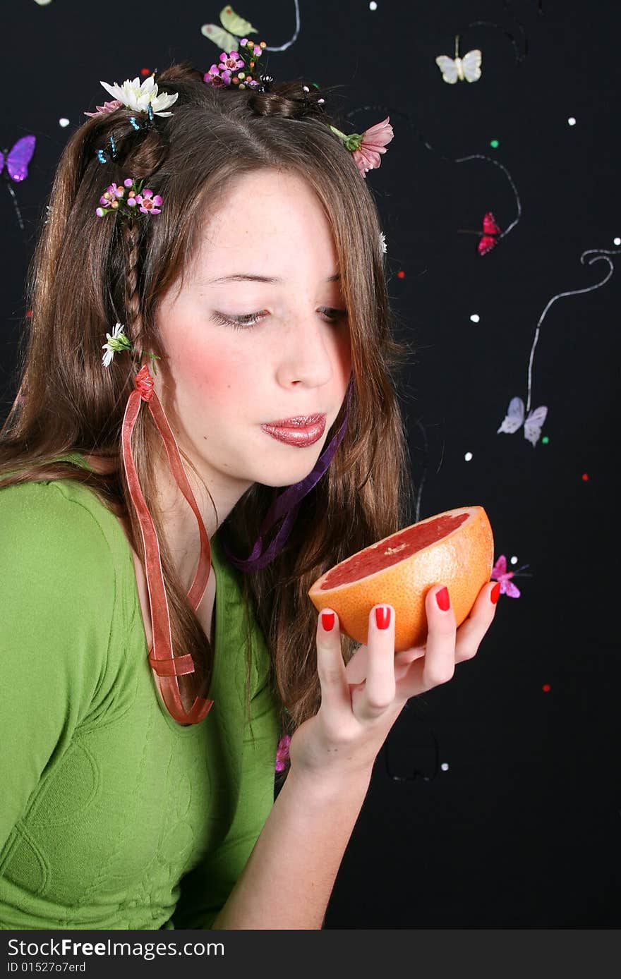 Teenage model with flowers and butterflies in her hair. Teenage model with flowers and butterflies in her hair