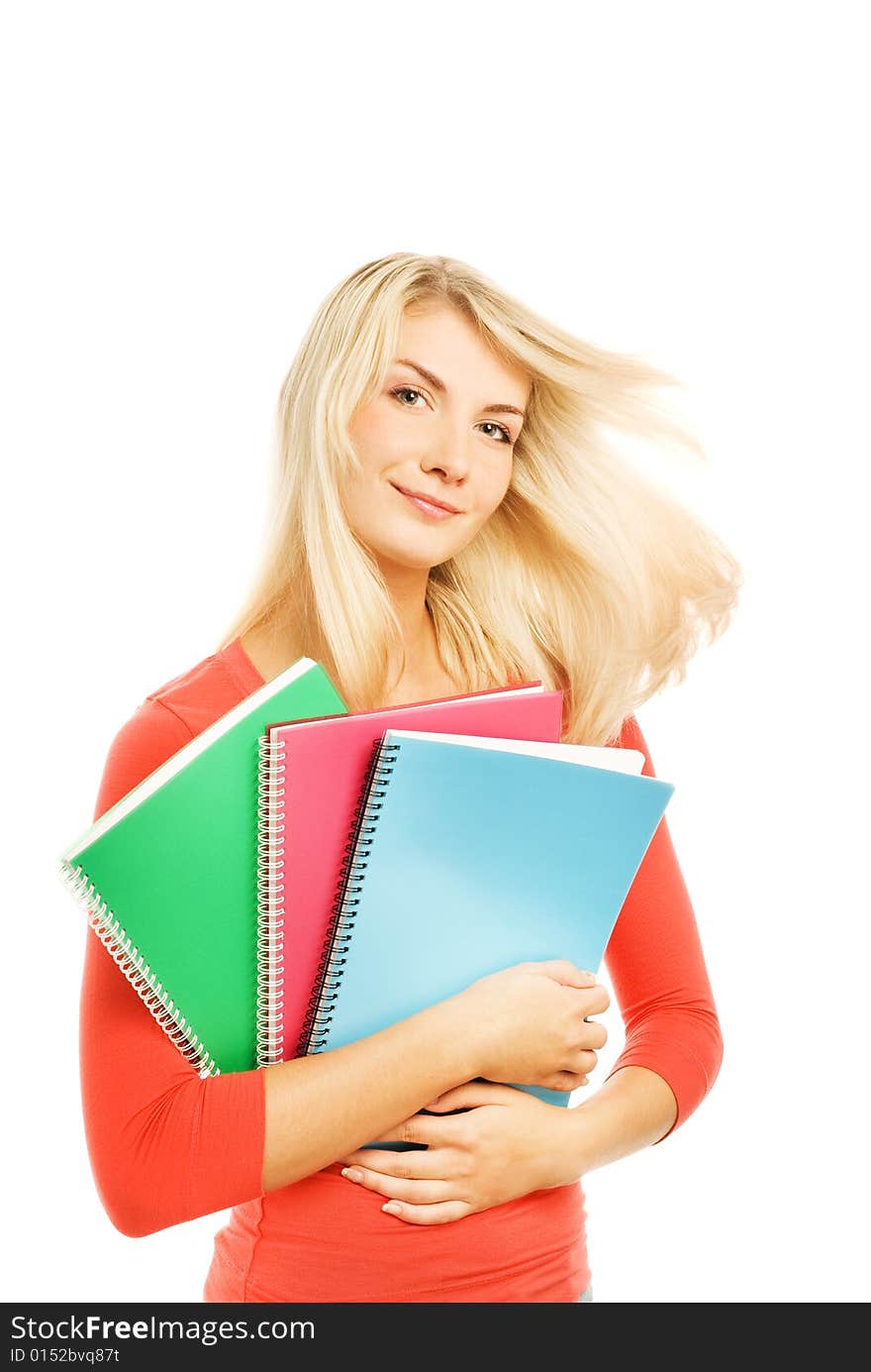 Attractive teenage girl with notebooks isolated on white background