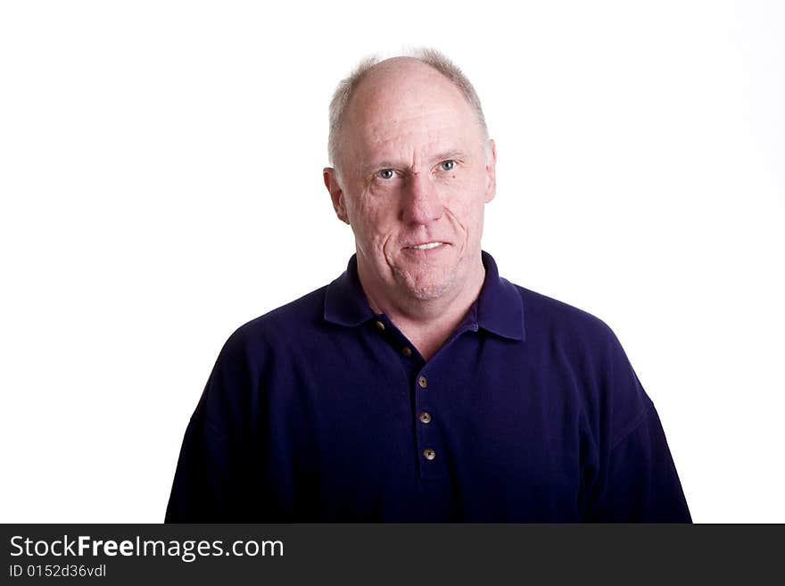 A nice older bald guy in a blue shirt on a white background smiling. A nice older bald guy in a blue shirt on a white background smiling