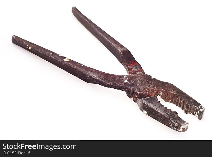 Big metal pliers on the white background. Old, used and rusty. Narrow depth of field. Big metal pliers on the white background. Old, used and rusty. Narrow depth of field.