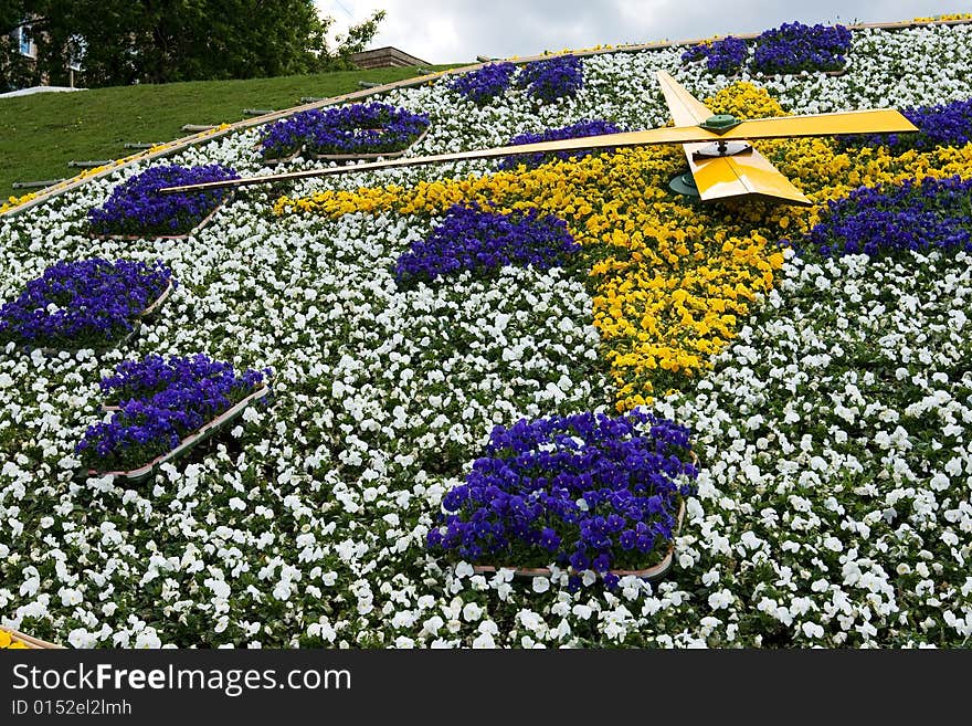 A closeup of a clock made of flowers outdoors. A closeup of a clock made of flowers outdoors