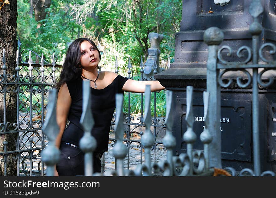 The girl-goth on a cemetery. The girl-goth on a cemetery