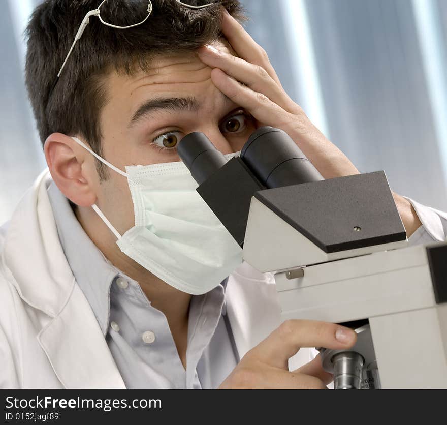 Scientist discovering something at microscope, chemistry related or medical design. Scientist discovering something at microscope, chemistry related or medical design