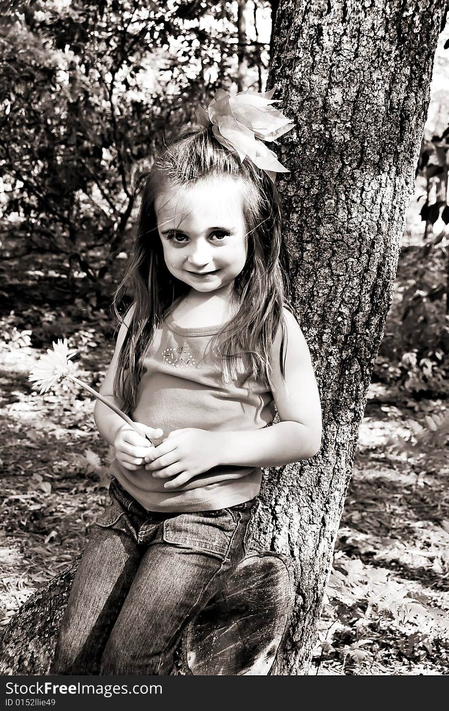 Little girl in an outdoor setting in brown tones. Little girl in an outdoor setting in brown tones