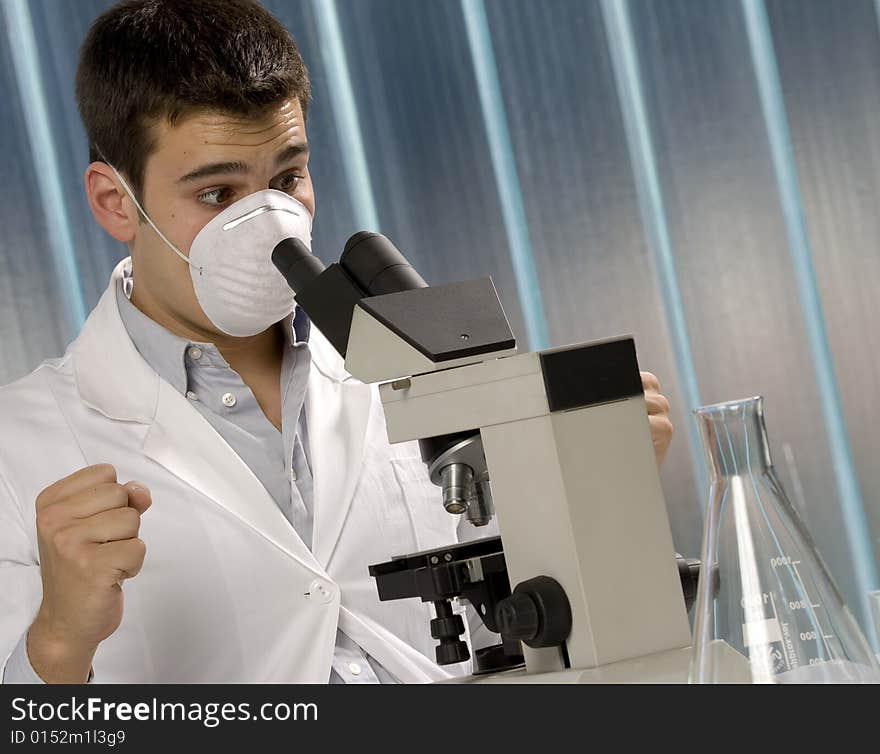 Scientist discovering something at the microscope, chemistry related or medical design. Scientist discovering something at the microscope, chemistry related or medical design