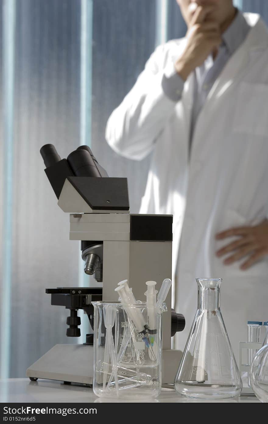 Young Scientist Thinking In His Lab