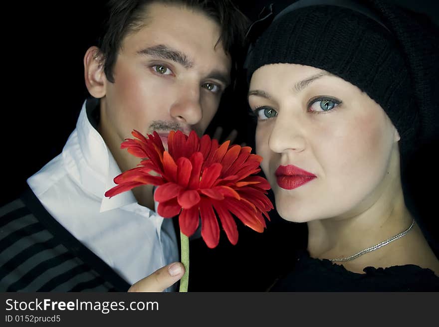 Loving couple with a red flower