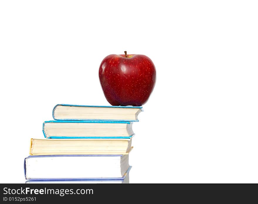 Red apple and stack of books for school. Red apple and stack of books for school