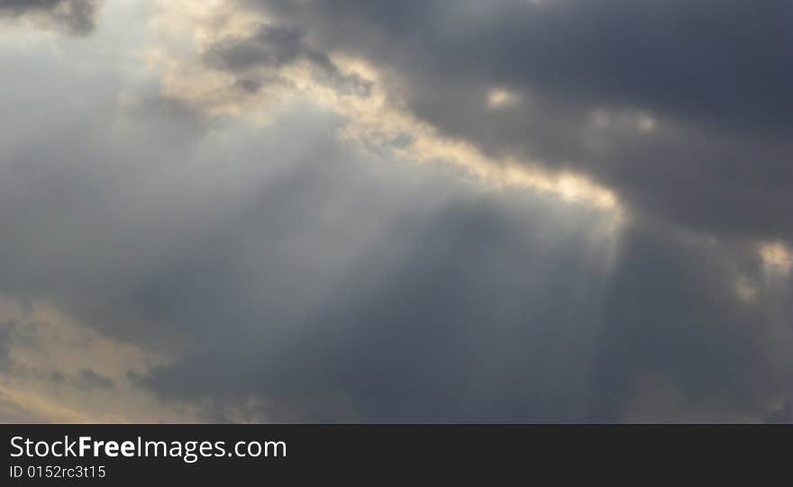 Beams and clouds on  background of  sky