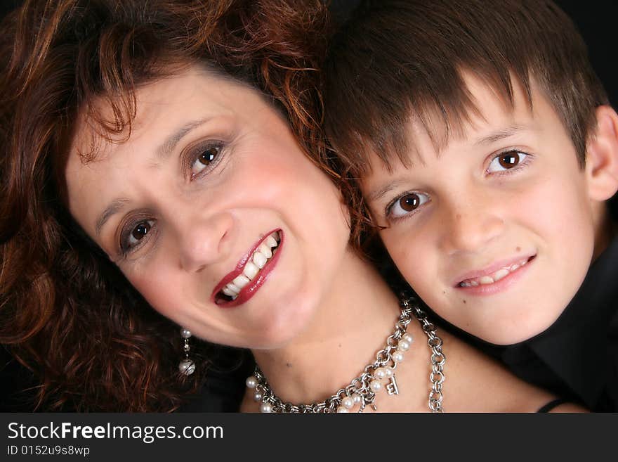 Rich and stylish mother and son in formal attire