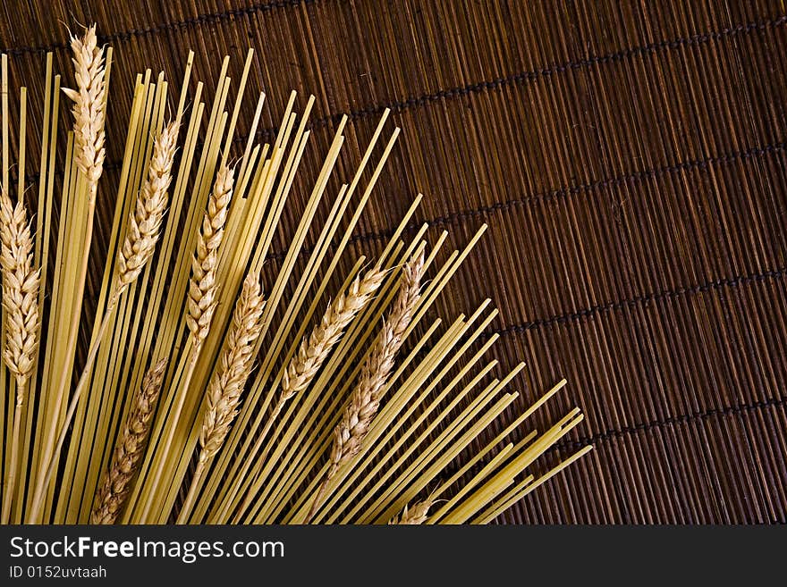 Bamboo board with spaghetti and grain