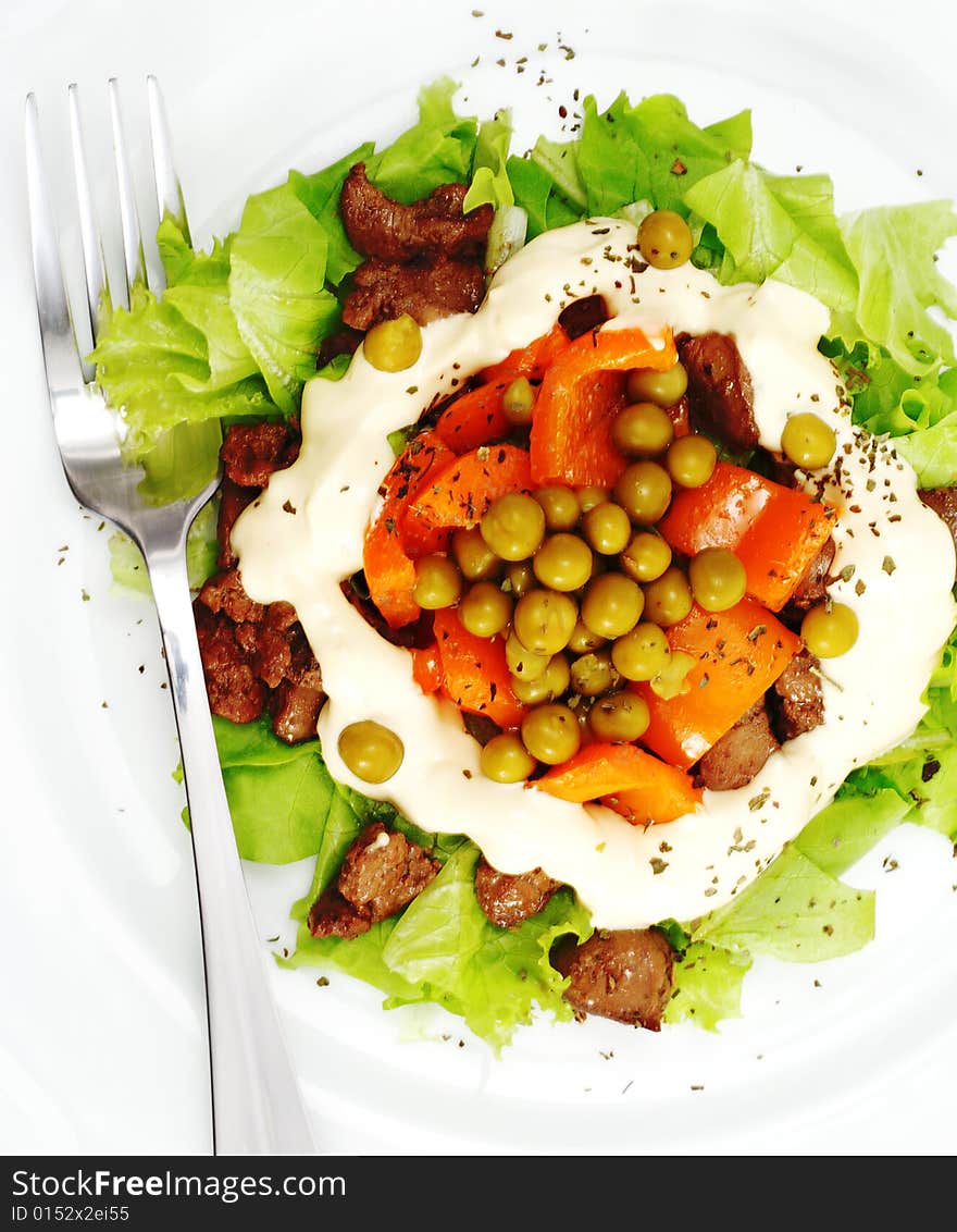 Chicken Salad Composed Chicken Liver and Pepper Dressed with Salad Leaves and Green Peas. Isolated on White Background