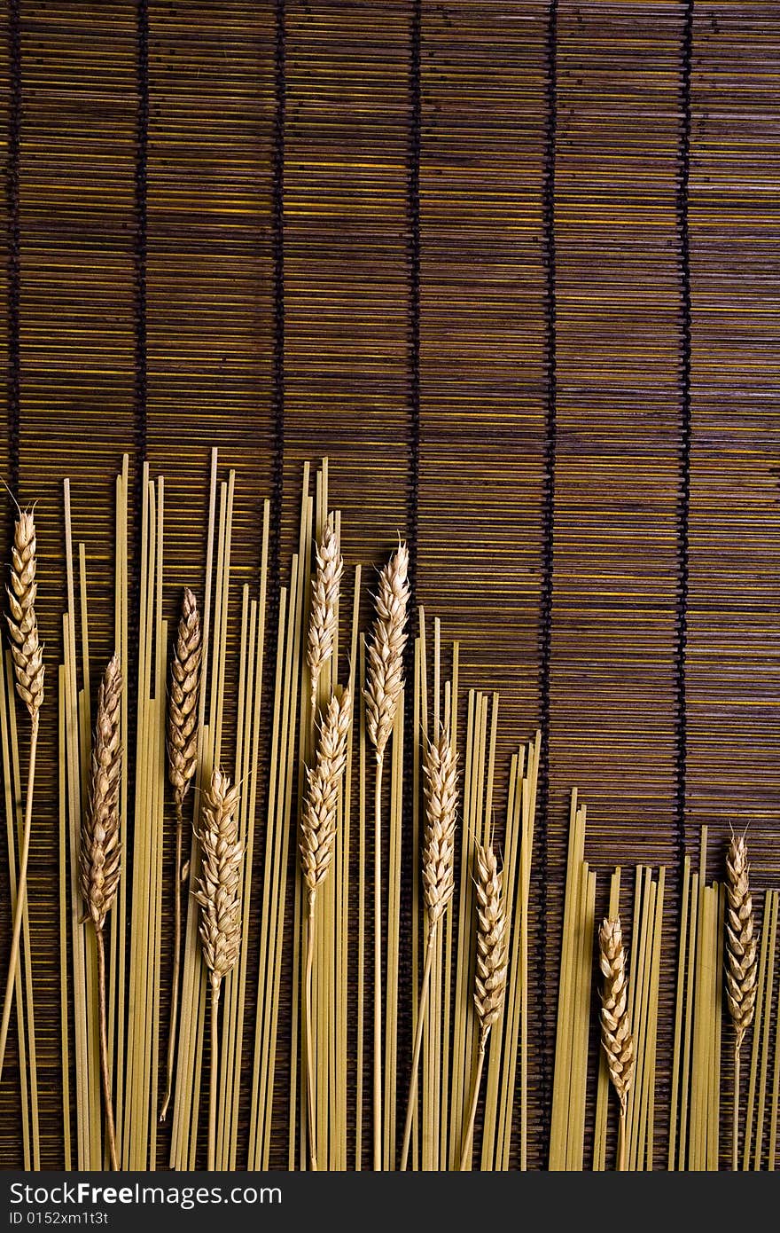 Bamboo board with spaghetti and grain