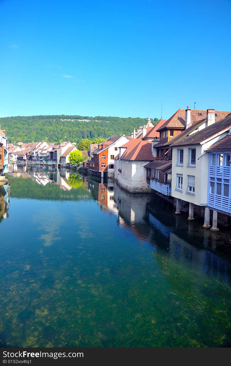 Beautiful little town at the Loue river in France. Beautiful little town at the Loue river in France