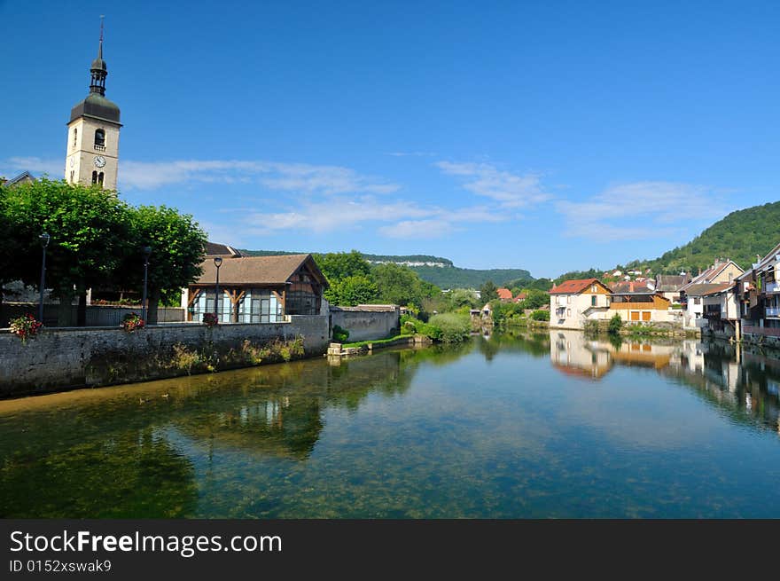 Beautiful little town at the Loue river in France. Beautiful little town at the Loue river in France