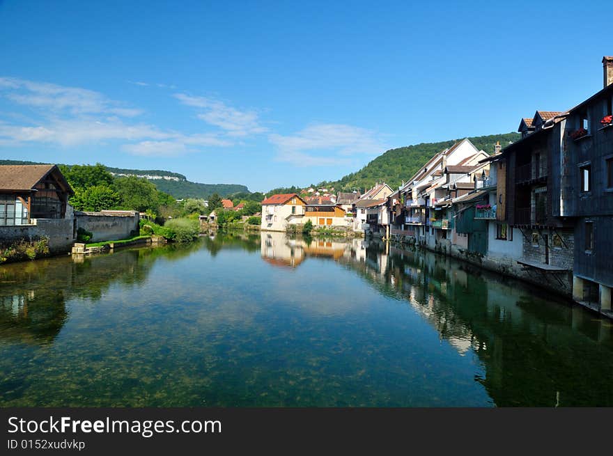 Beautiful little town at the Loue river in France. Beautiful little town at the Loue river in France