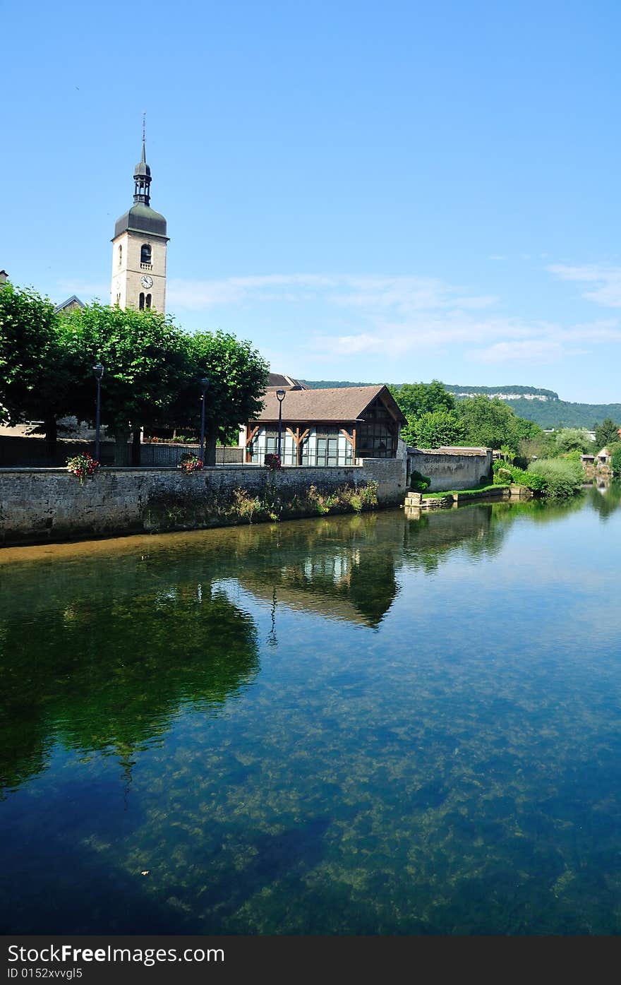 Beautiful little town at the Loue river in France. Beautiful little town at the Loue river in France