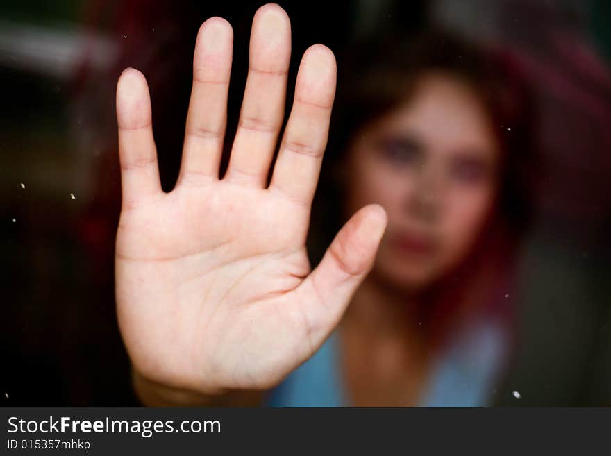 Lonely women In the glass. Hand close up. Lonely women In the glass. Hand close up.