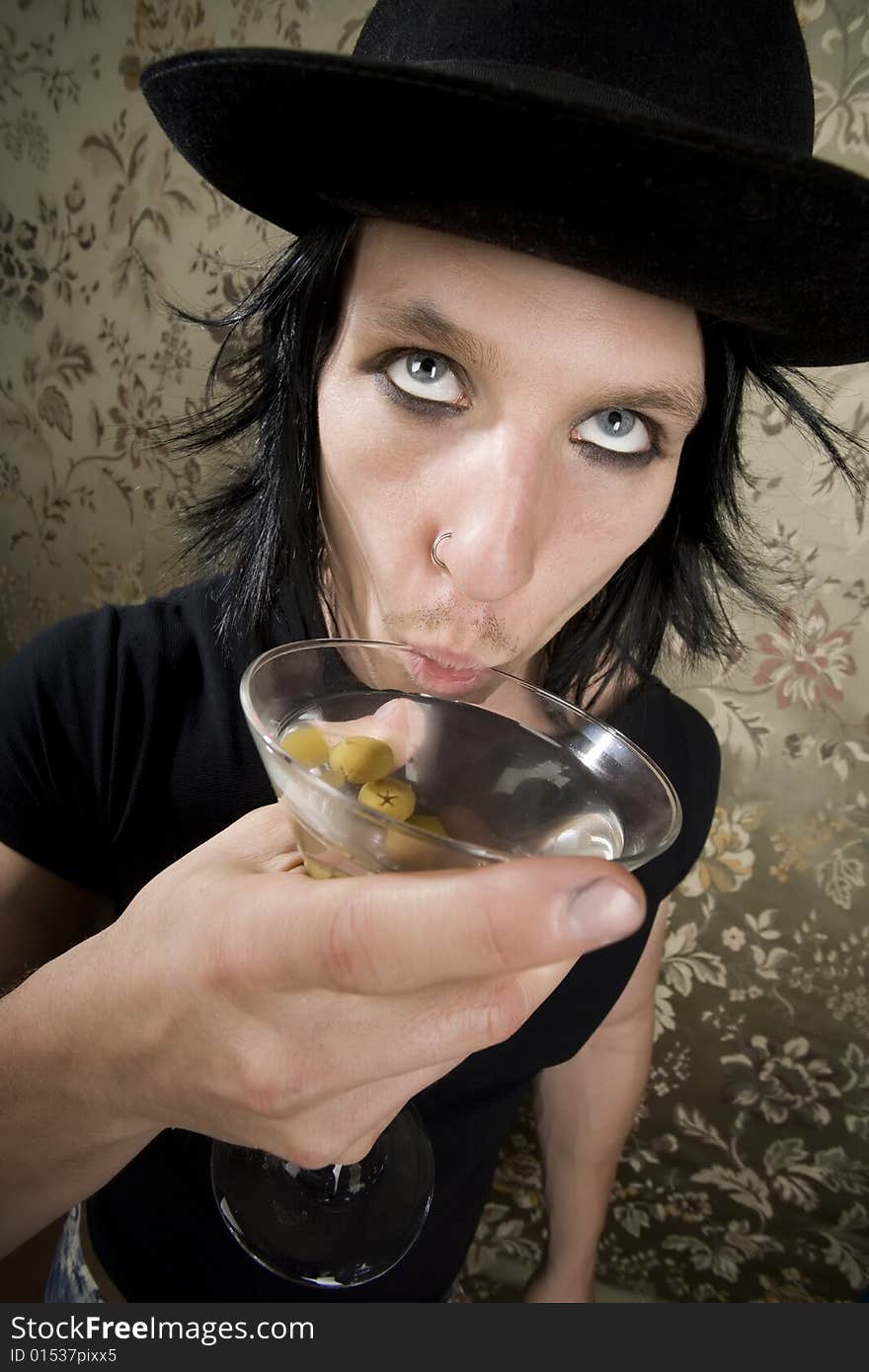 Young Man with a Dark Hat and Martini. Young Man with a Dark Hat and Martini