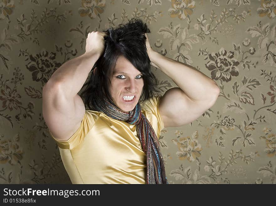 Frustrated Muscular Young Man Pulling Out His Black hair