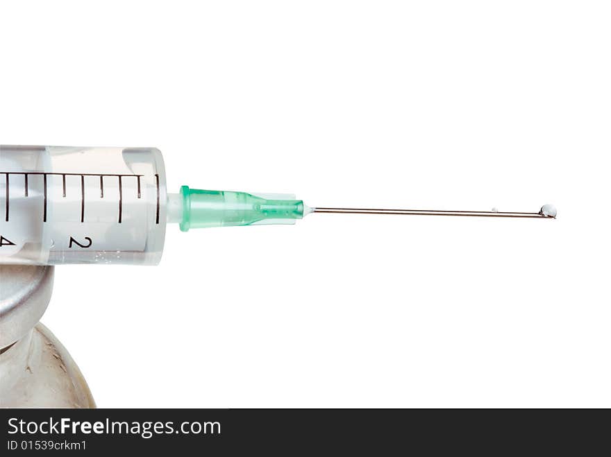 Drop on a tip of a needle of a syringe, it is isolated, on a white background. Drop on a tip of a needle of a syringe, it is isolated, on a white background.