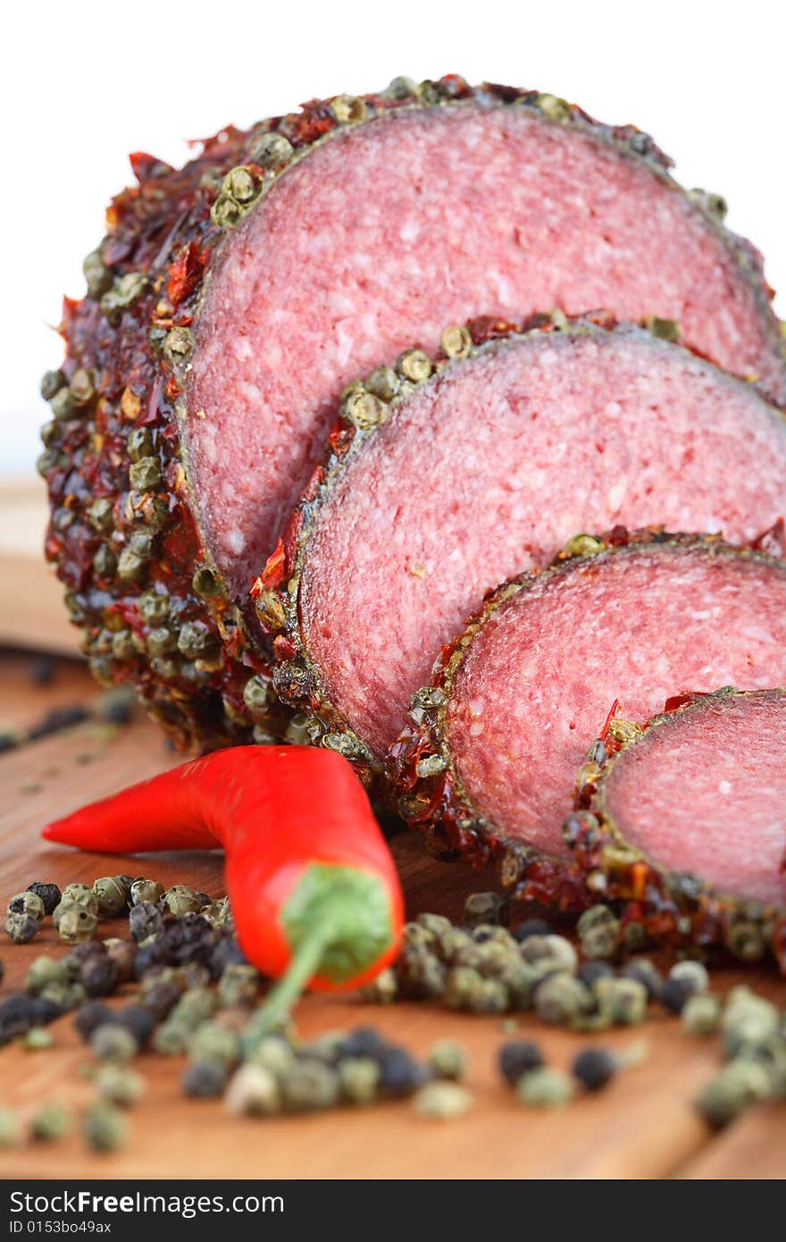 Salami with red pepper and pepper grains