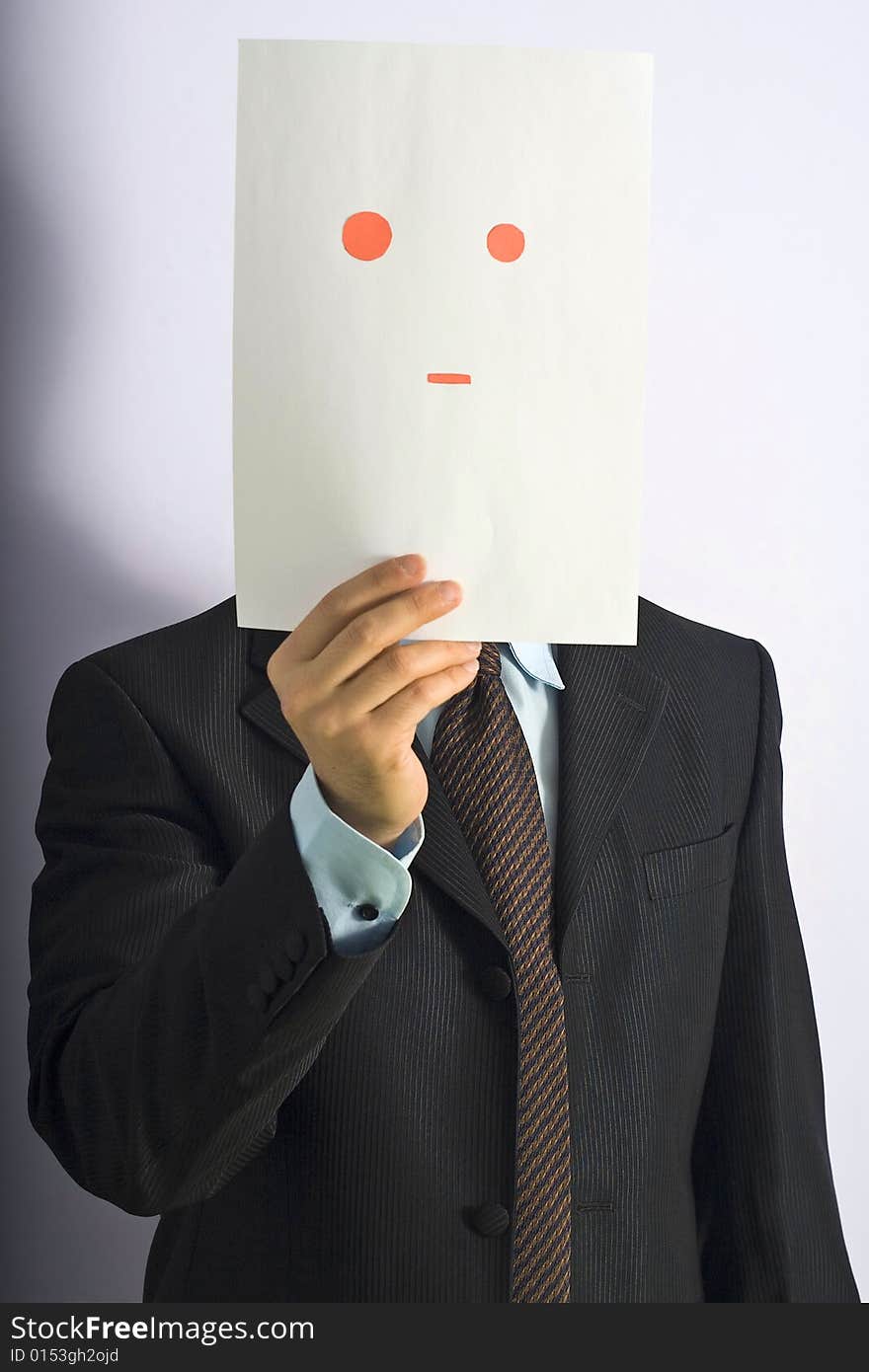 Businessman gesticulating face of paper