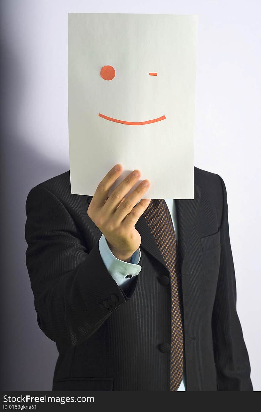 Businessman gesticulating face of paper