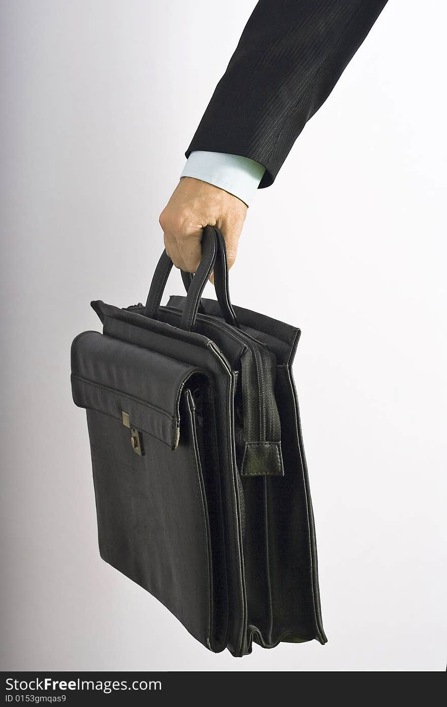 Businessman carrying his briefcase of work