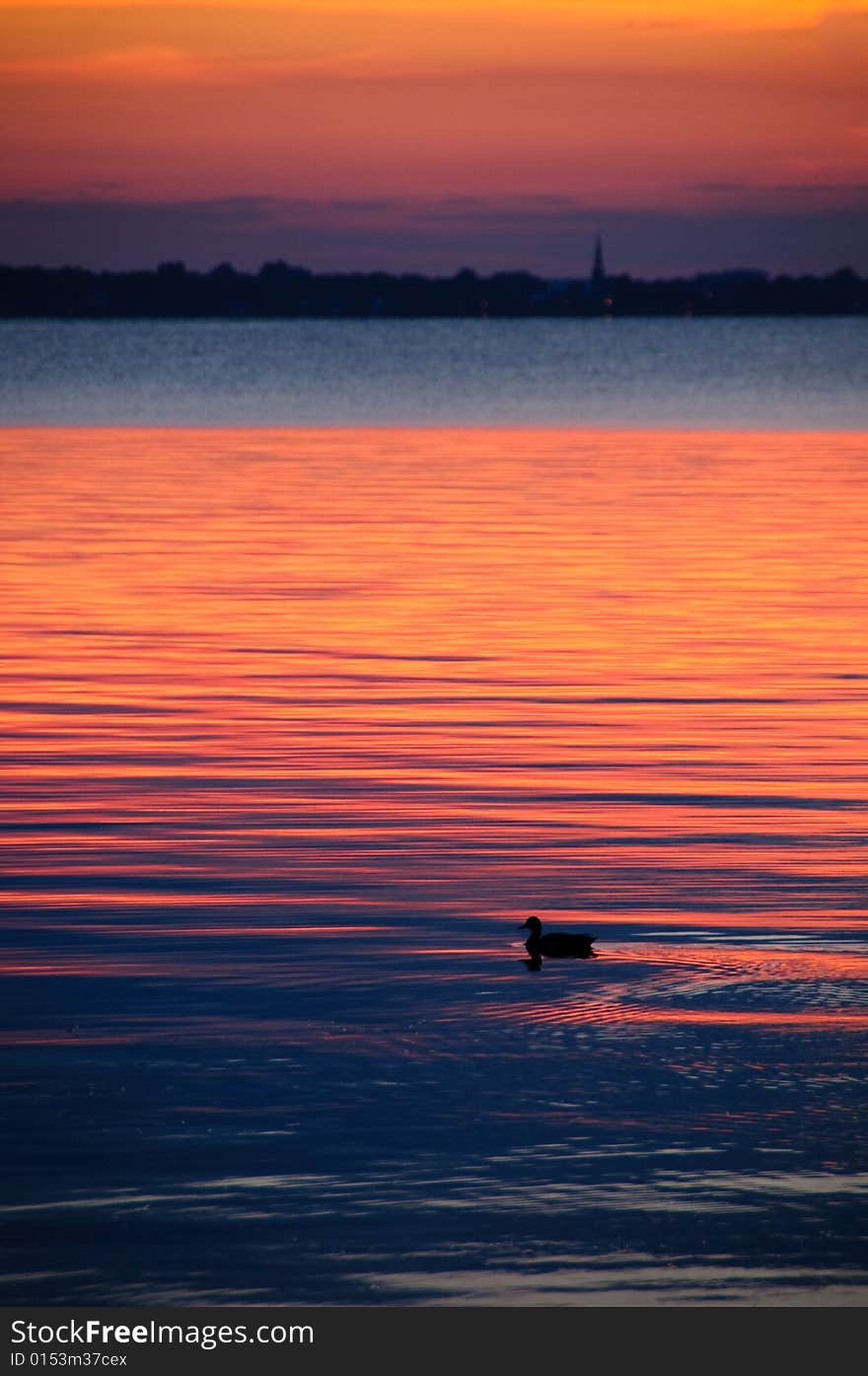 Watching a sunset on the calm water