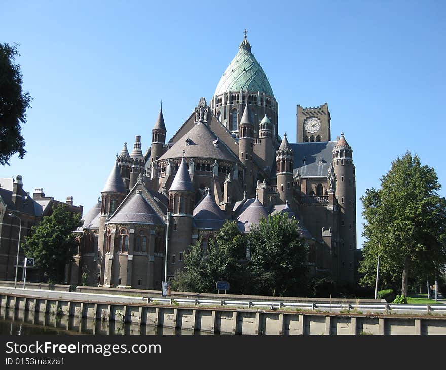 St. Bavo church in Haarlem, the Netherlands. This roman catholic structure was completed in 1925 and has two different towers. St. Bavo church in Haarlem, the Netherlands. This roman catholic structure was completed in 1925 and has two different towers