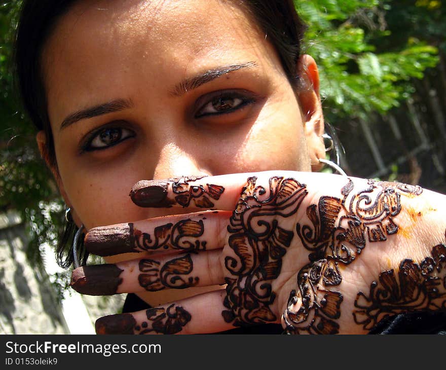 A girl with designed mehendi on her hand. A girl with designed mehendi on her hand