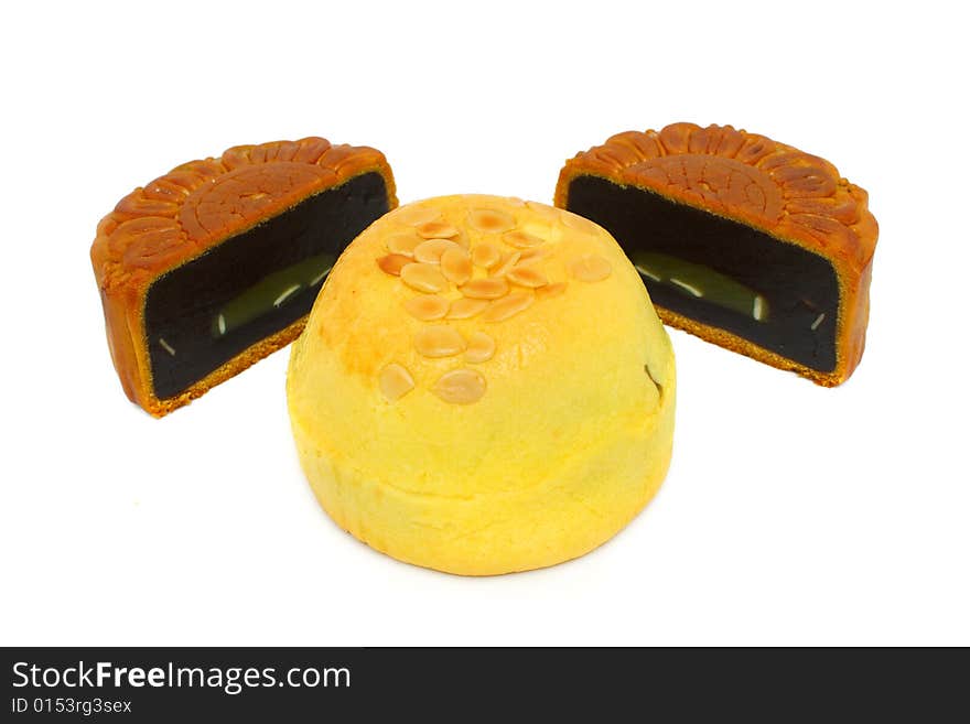 A mooncake slice into half puts behind Shanghai mooncake. A mooncake slice into half puts behind Shanghai mooncake.